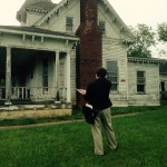Outside of the J. Sidna Allen home is Hunter Greene, RA ~ Project Manager, Architect