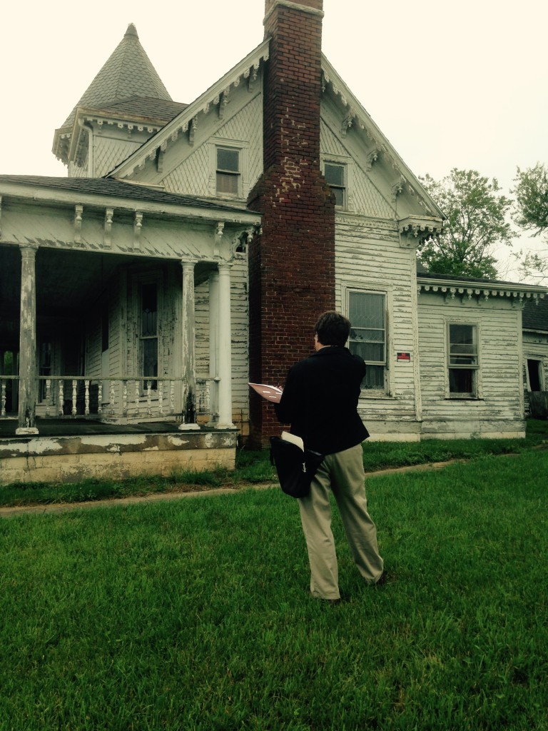 Outside of the J. Sidna Allen home is Hunter Greene, RA ~ Project Manager, Architect
